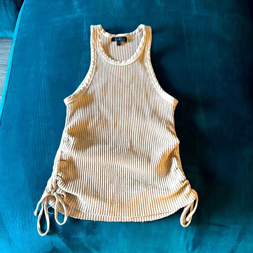 Women’s beige top fits like a small